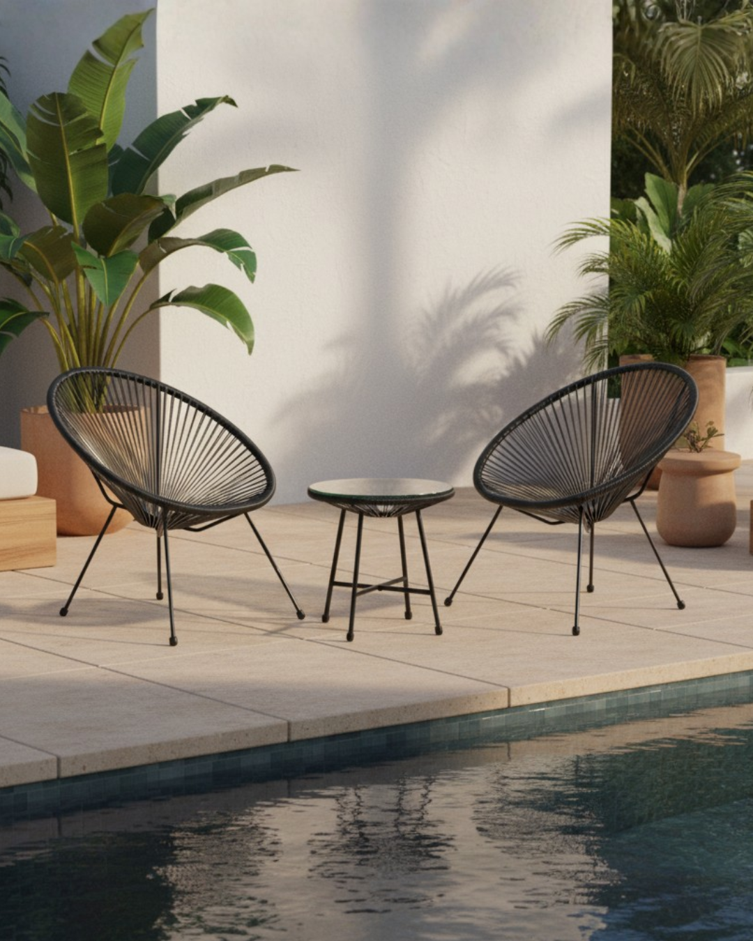 Black bistro set by poolside
