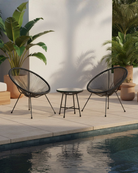 Black bistro set by poolside