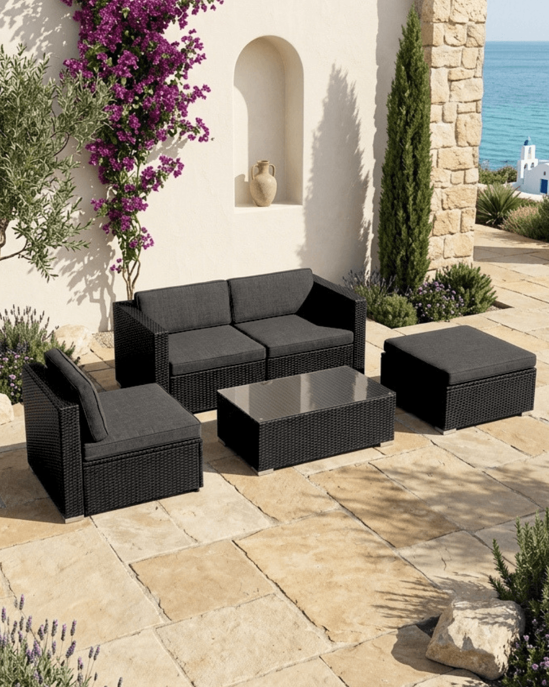 Black rattan modular garden furniture with cushions outdoors
