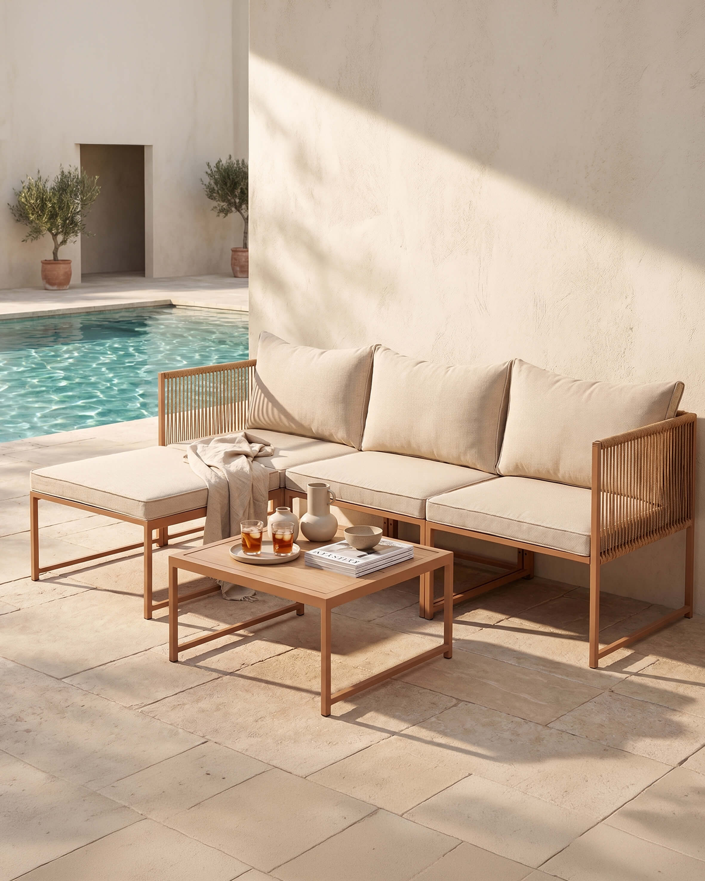 Metal garden sofa with beige cushions and coffee table