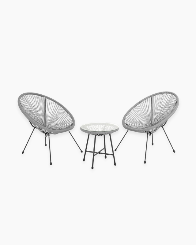 Two rattan chairs and a small table for outdoor bistro