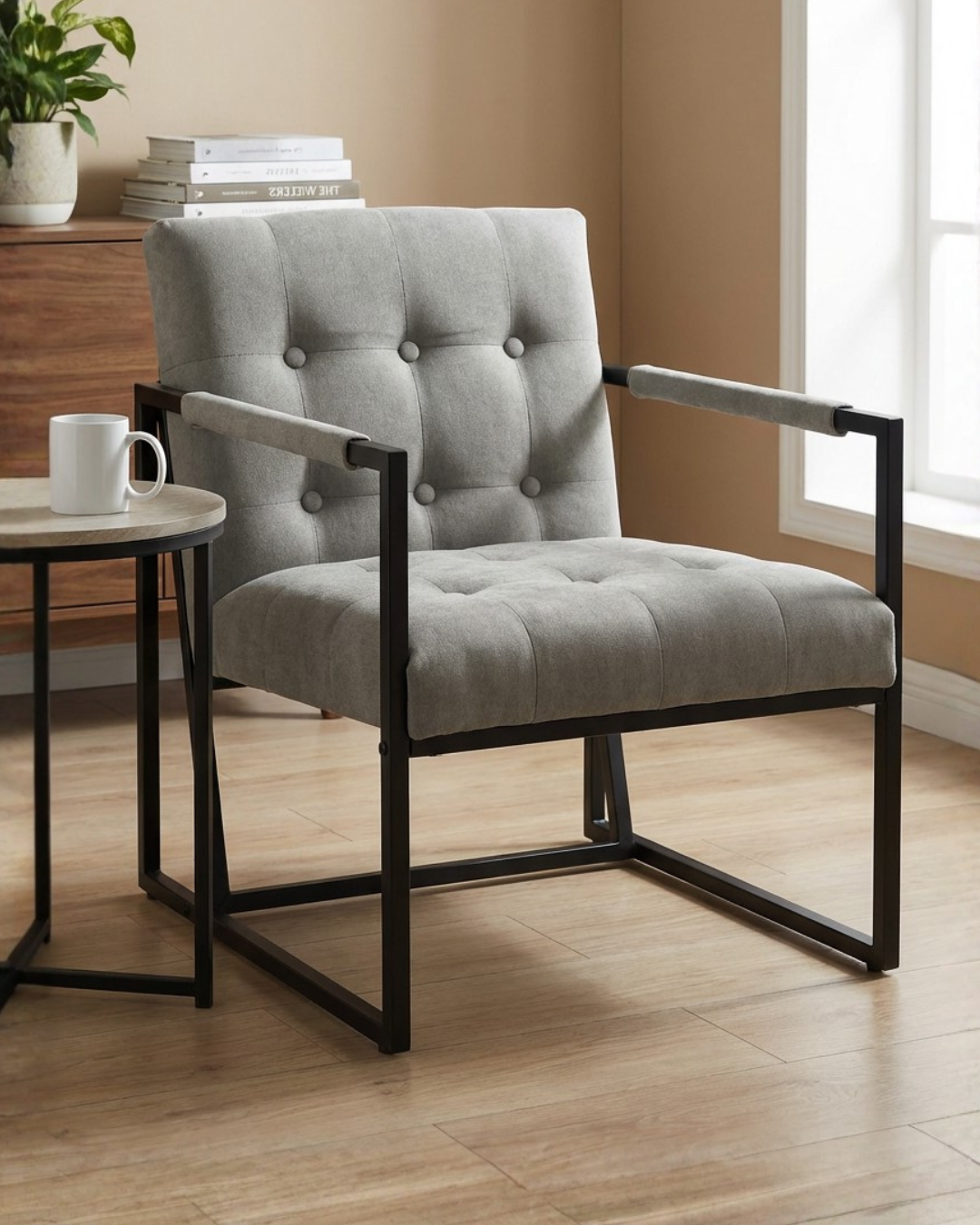 Grey upholstered armchair with black metal frame in living room