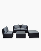 Outdoor furniture set with black rattan frame and thick grey cushions