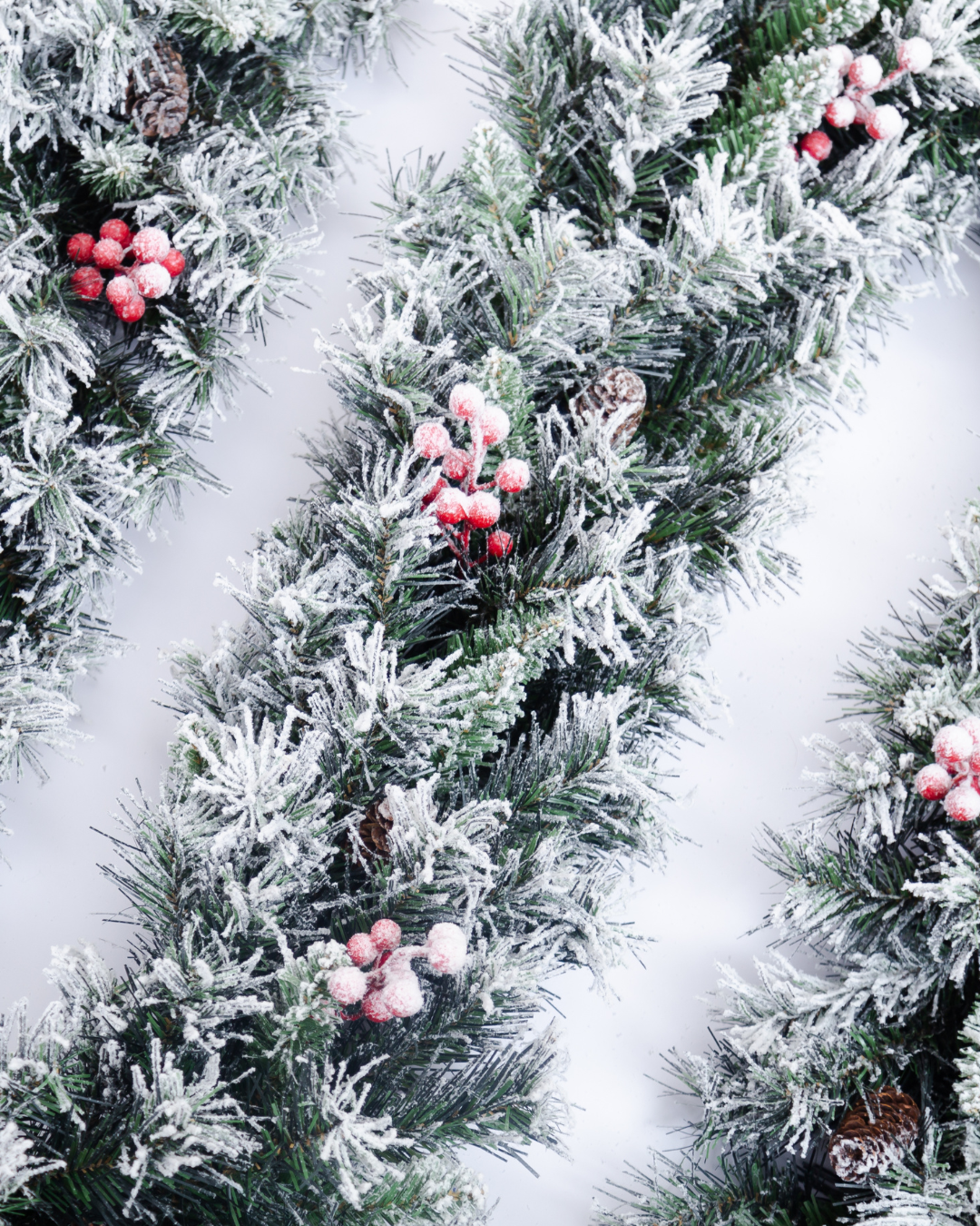 Close-up of snow-frosted artificial Christmas garland
