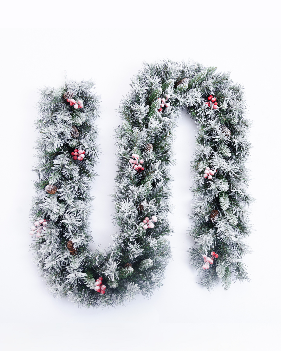 Artificial garland with berries and pine cones