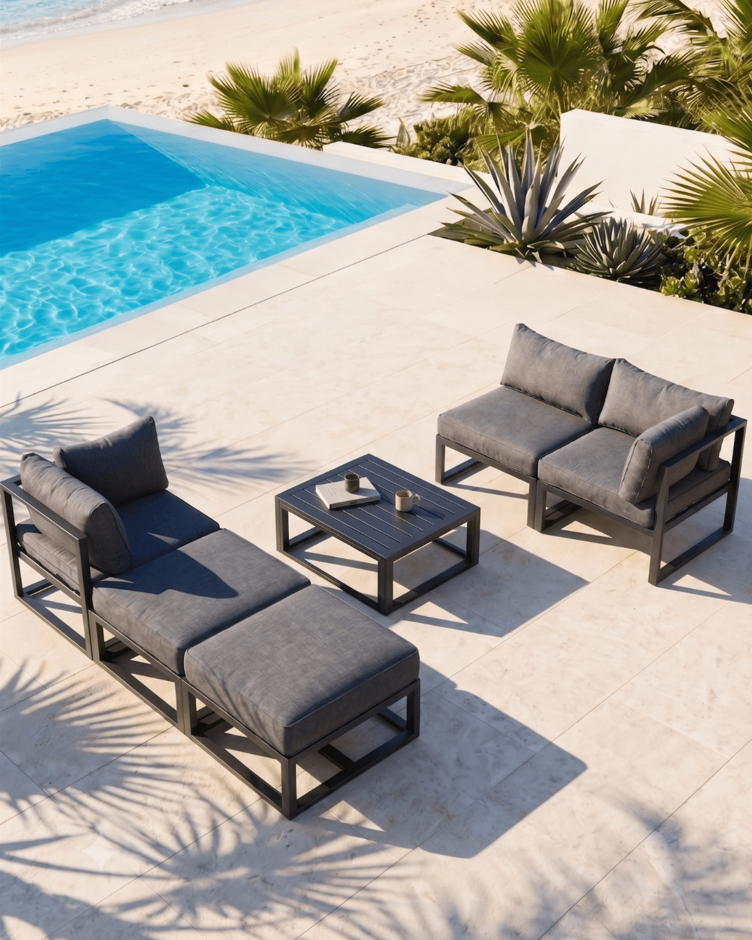 Modular aluminium outdoor furniture and a small square coffee table on stone decking