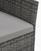 close-up of grey rattan sofa leg