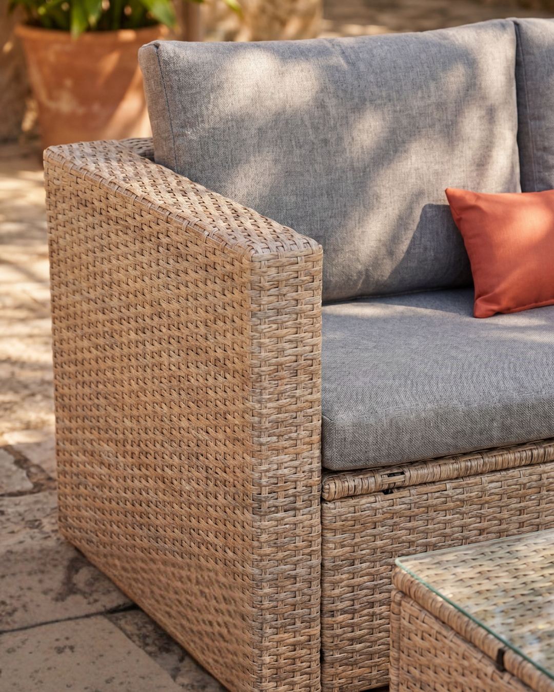 Malibu Rattan 3 Seat Garden Furniture Set with plush cushions in a natural outdoor setting during golden hour