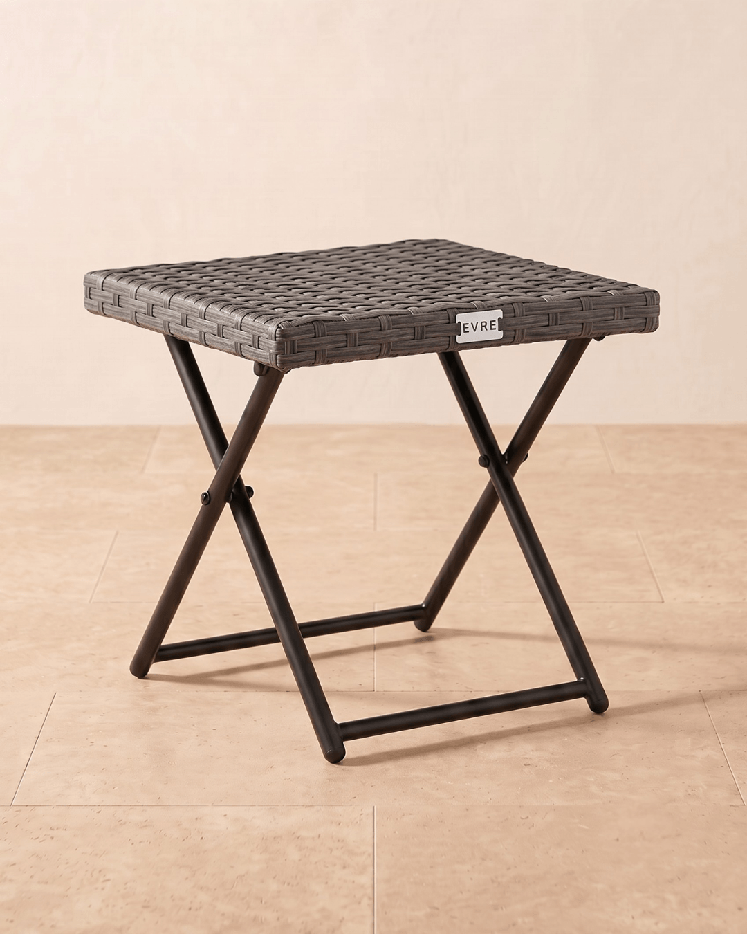 A square mountain oak grey woven rattan side table with a folding metal frame