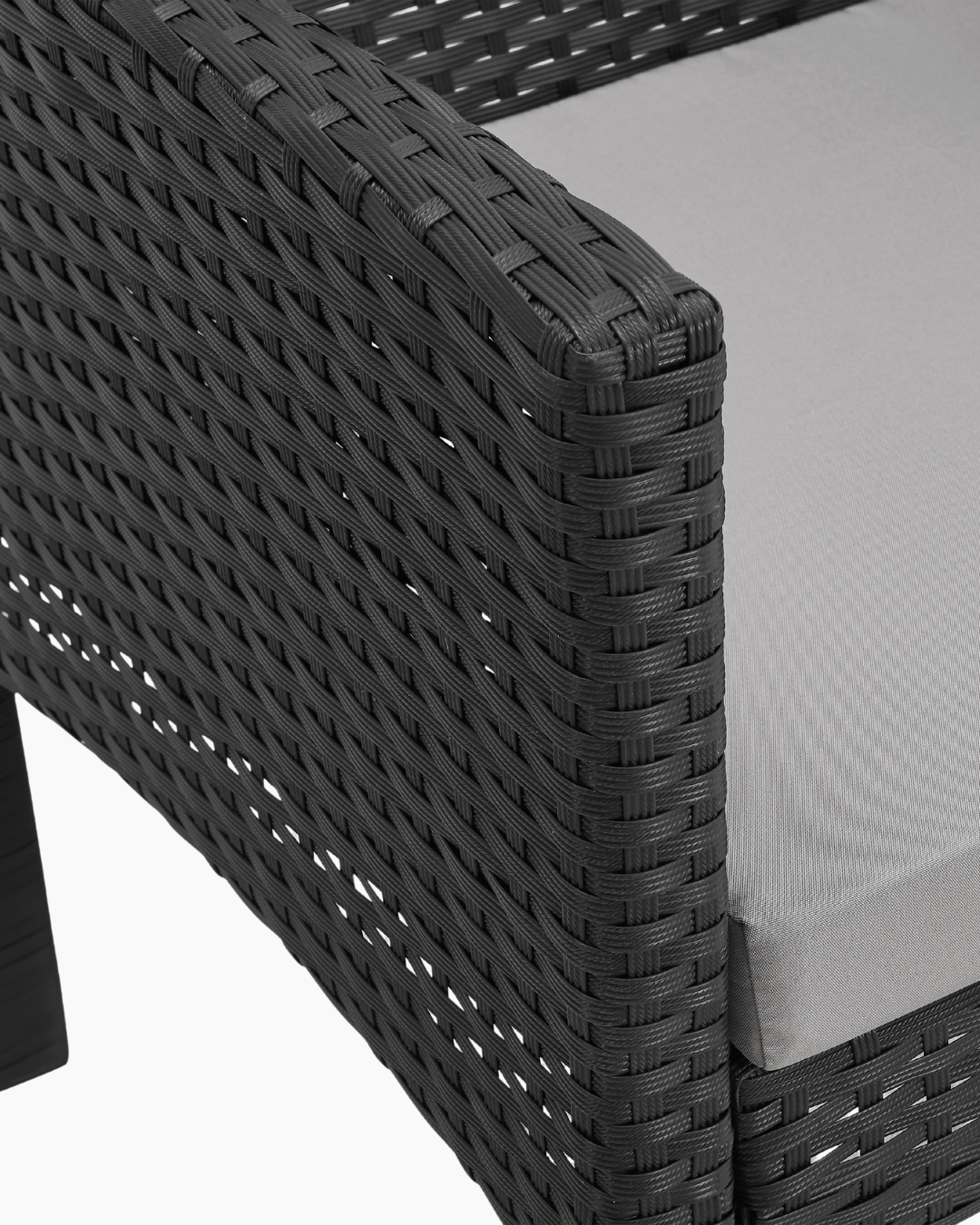 Close-up of a black woven chair with grey seat cushion