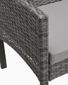 Grey wicker chair with cushion