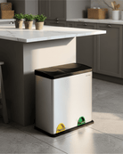 Silver trash bin with colour-coded doors in a kitchen setting