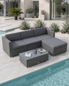 Grey Rattan Garden Corner Sofa Set with Coffee Table on a light stone patio beside a swimming pool