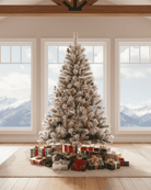 Decorated 7ft large white Christmas tree with presents in a room with large windows