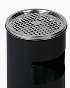 Silver ashtray atop black cigarette bin