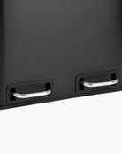 Close-up of a black bin with silver pedals