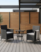 Black rattan bistro set for 2 on a wooden deck