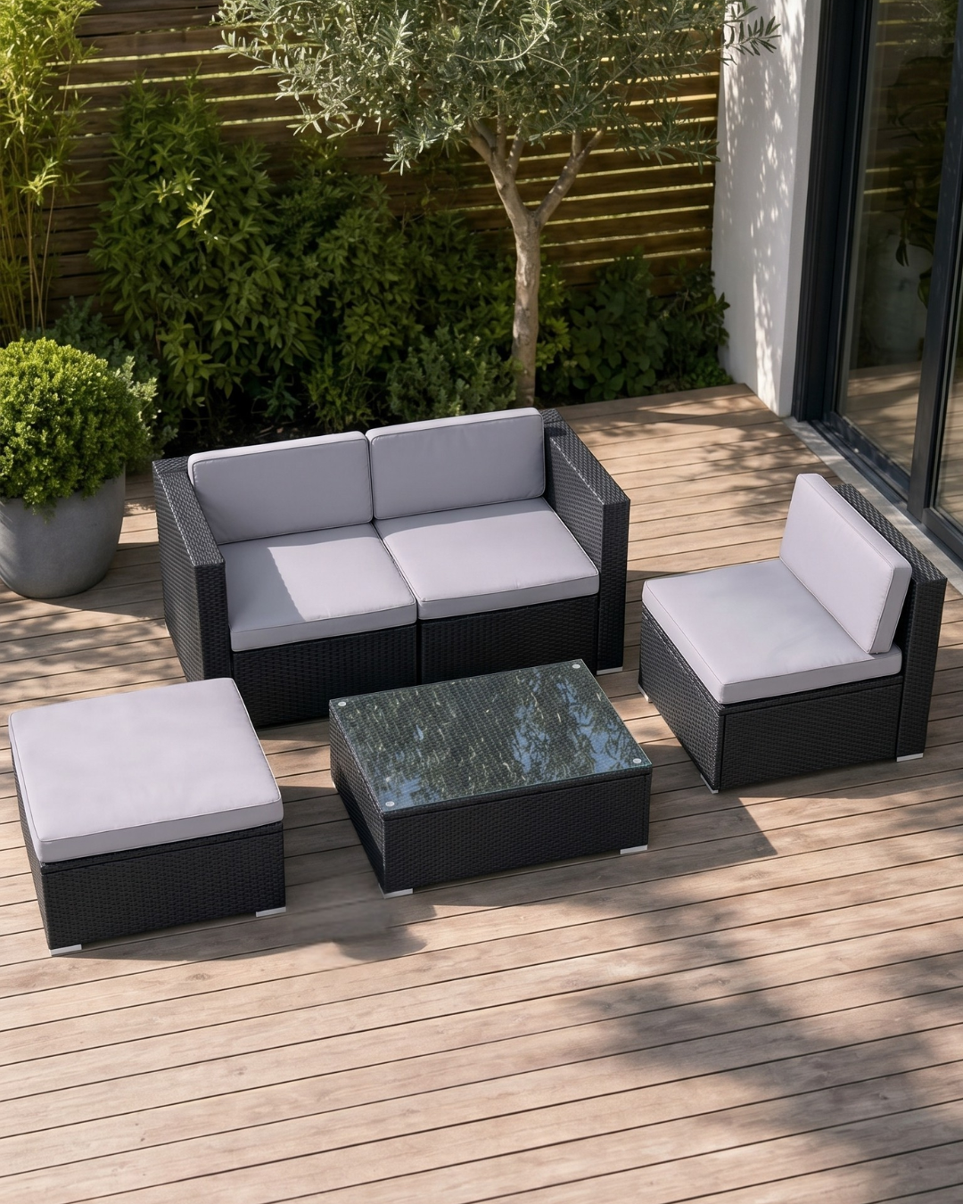 Black rattan modular garden furniture set with grey cushions