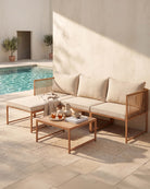Metal garden sofa with beige cushions and coffee table