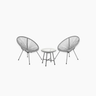 Two rattan chairs and a small table for outdoor bistro