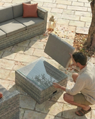 Grey rattan garden furniture with storage for cushions