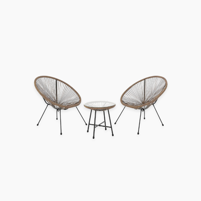 Two wicker chairs and a small table in a cosy bistro set