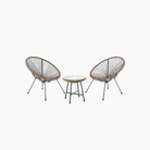 Two wicker chairs and a small table in a cosy bistro set