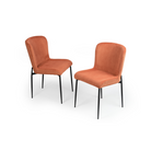 Two orange chairs for dining room