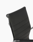 Sleek black office chair with chrome armrests