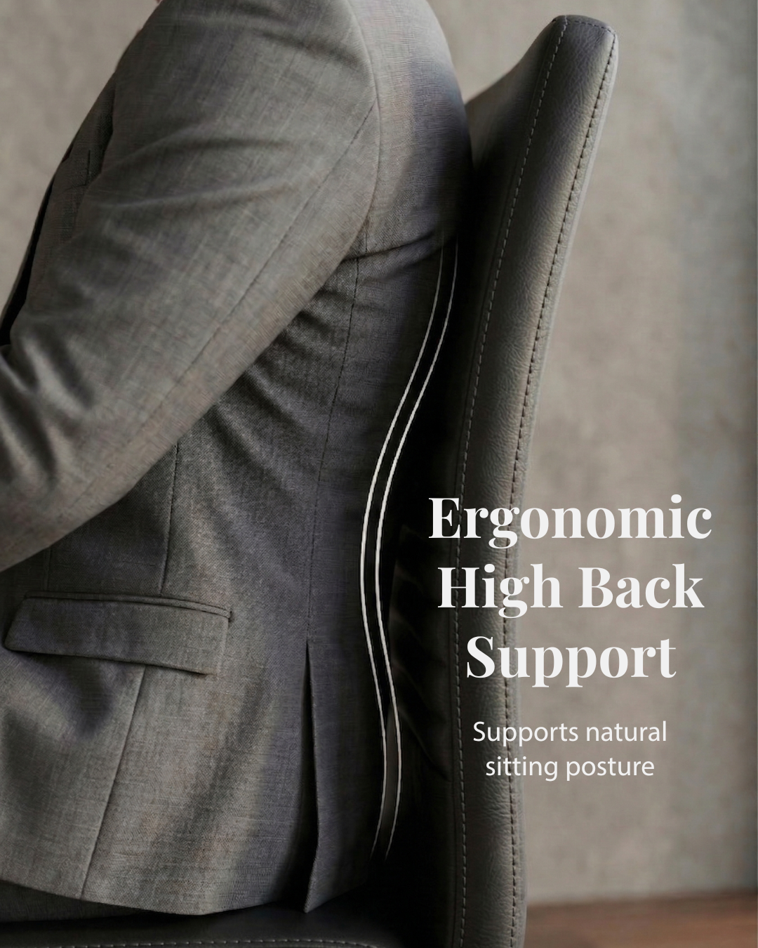 Person in a suit sitting on an ergonomic chair with high back