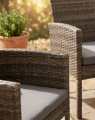 Wicker outdoor furniture with cushions on a patio
