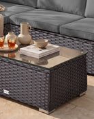 Brown rattan outdoor sofa set with coffee table