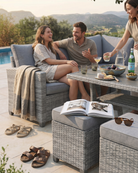 Friends casual dining al fresco on grey rattan garden furniture