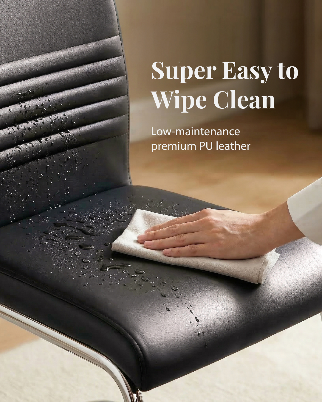 Wiping clean a black faux leather chair with a white cloth