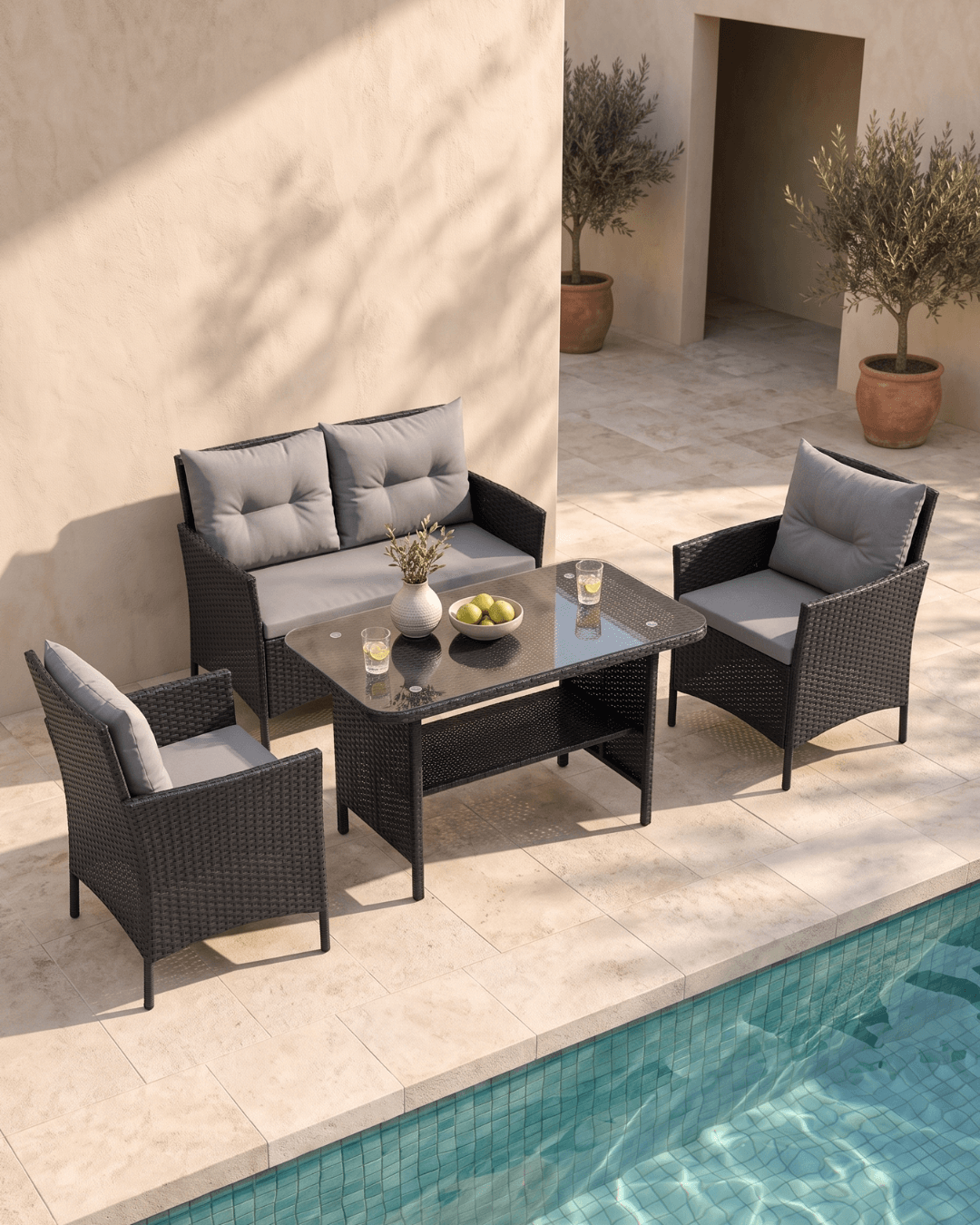 Black Rattan Garden 4 Seat Dining Set by the pool