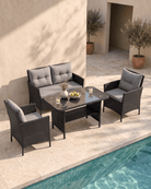 Black Rattan Garden 4 Seat Dining Set by the pool