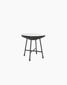 Small round outdoor table with a glass top