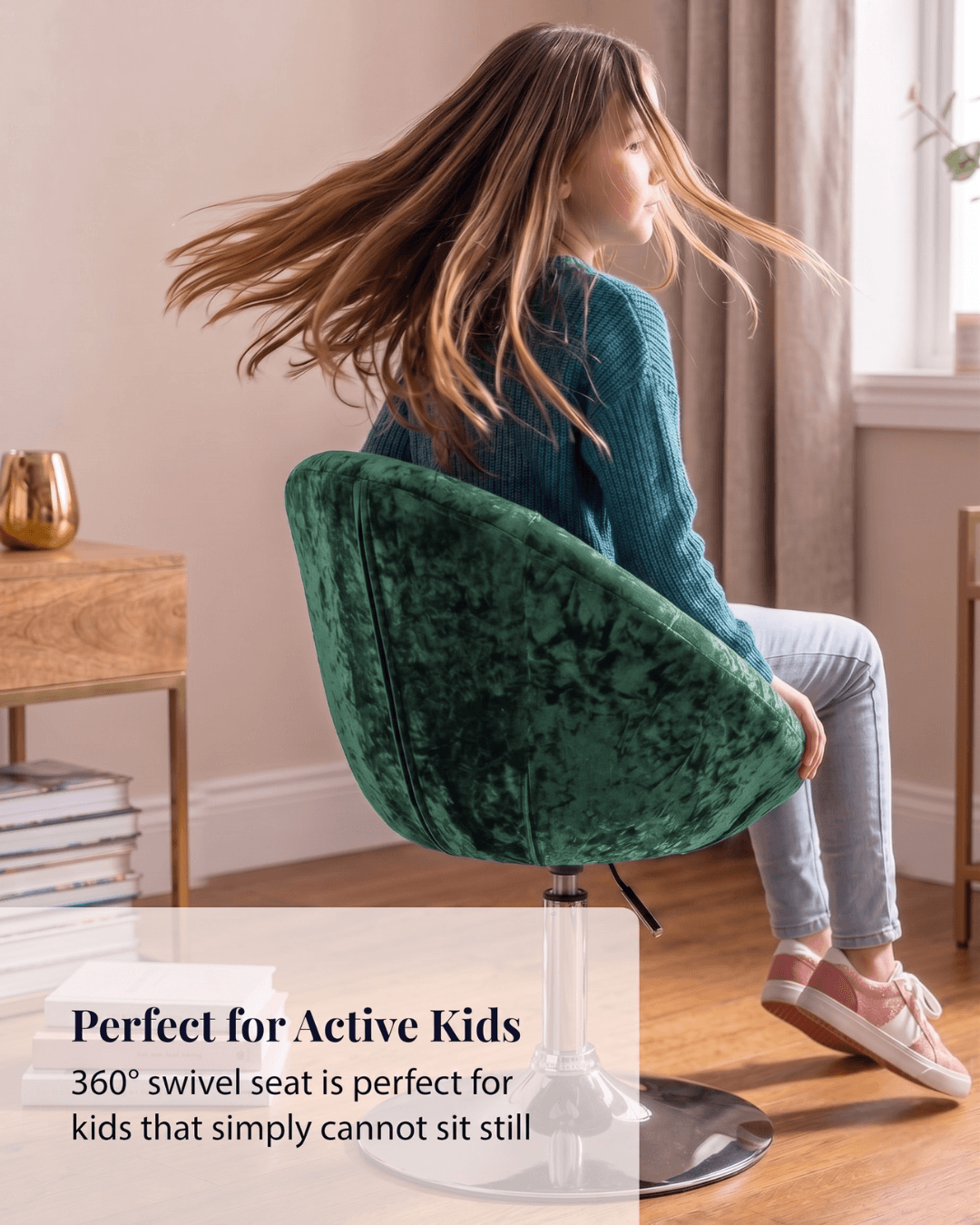 Girl twirling round in a green velvet swivel chair in a bright room