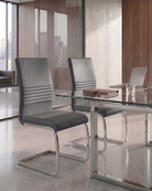 Modern glass dining table with grey chairs in a stylish office setting