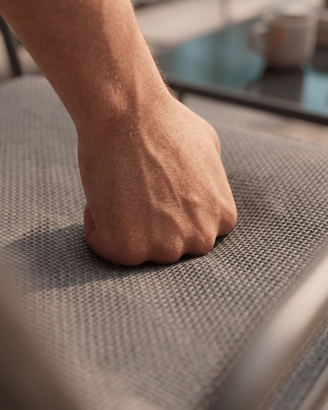Close-up of on the textilene surface of a lounge seat outdoors