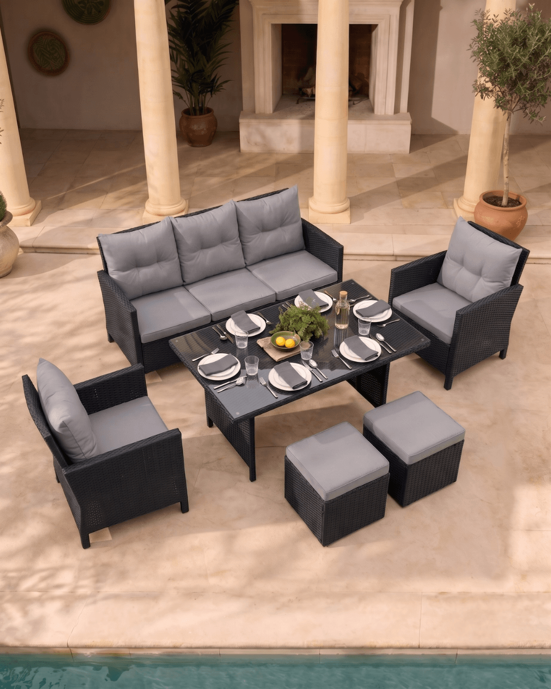 6-piece large outdoor patio dining set with a three-seater sofa, two armchairs, a rectangular coffee table, and two ottomans