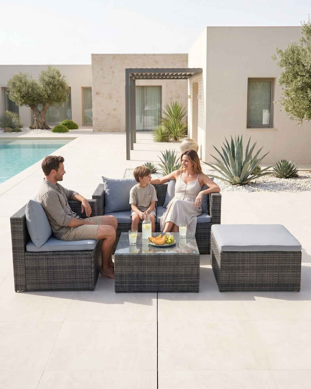 5-piece grey rattan garden furniture by the pool
