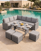 A large corner sofa featuring grey wicker sectional sofas, matching ottomans, and a rectangular dining table with a glass top, arranged on a stone patio next to a swimming pool