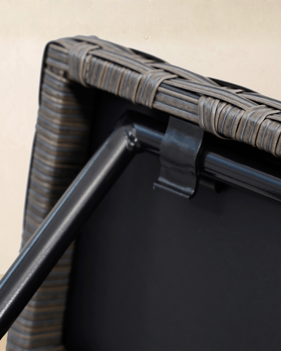 Close-up detail of a rattan side table with mountain oak grey rattan tabletop