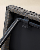 Close-up detail of a rattan side table with mountain oak grey rattan tabletop