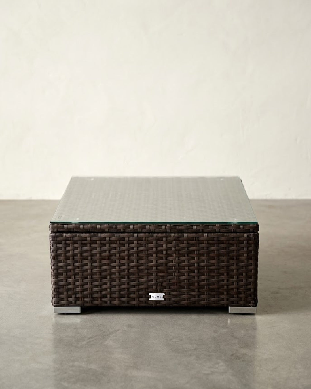 Brown wicker coffee table with glass top