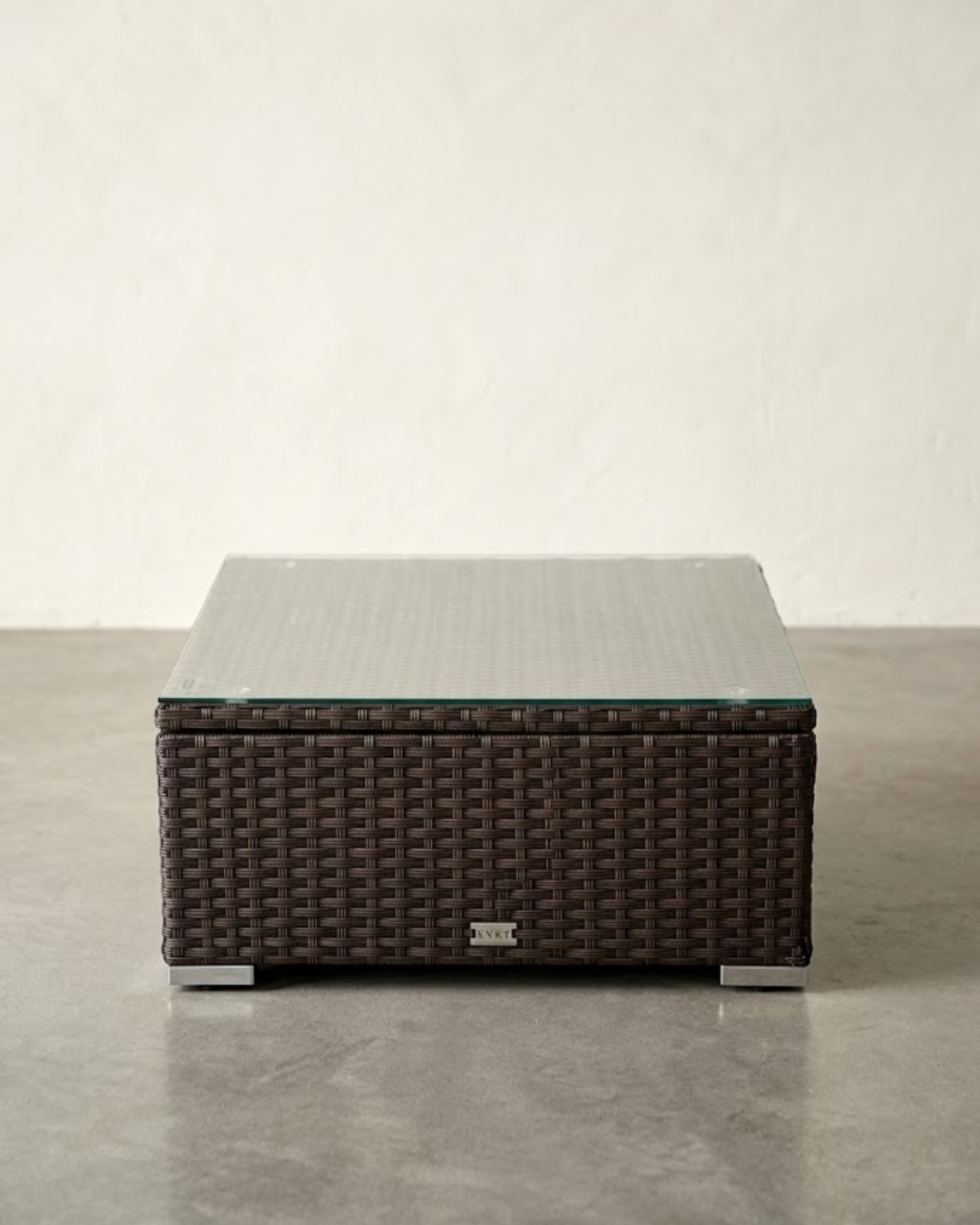 Brown wicker coffee table with glass top