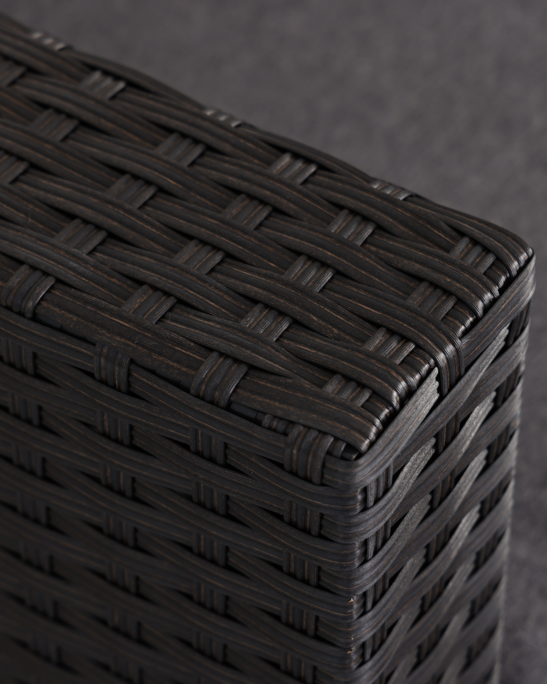 Close-up of a woven rattan sofa