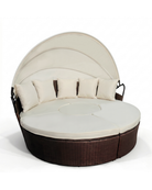 Brown rattan round outdoor daybed with canopy and cream cushions