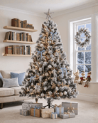 A snow-flocked artificial tree in the living room